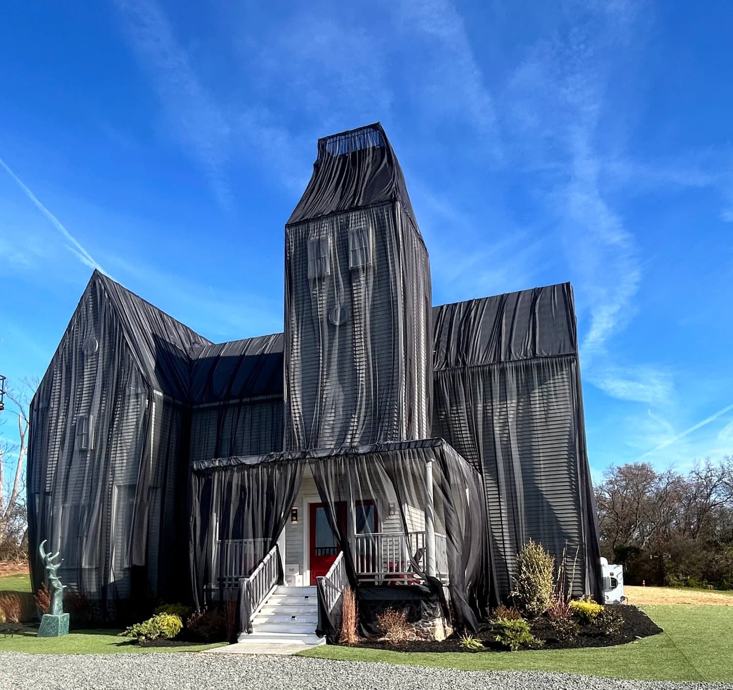 Large-scale building wrap art installation by Purple Heart Fabrication Shop