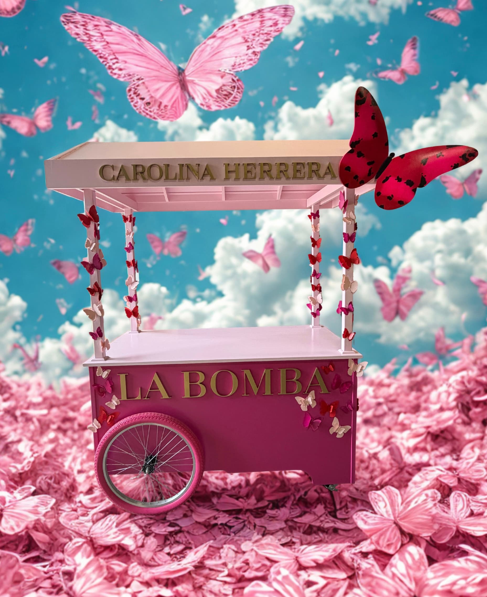 Custom pink Carolina Herrera La Bomba cart decorated with butterflies