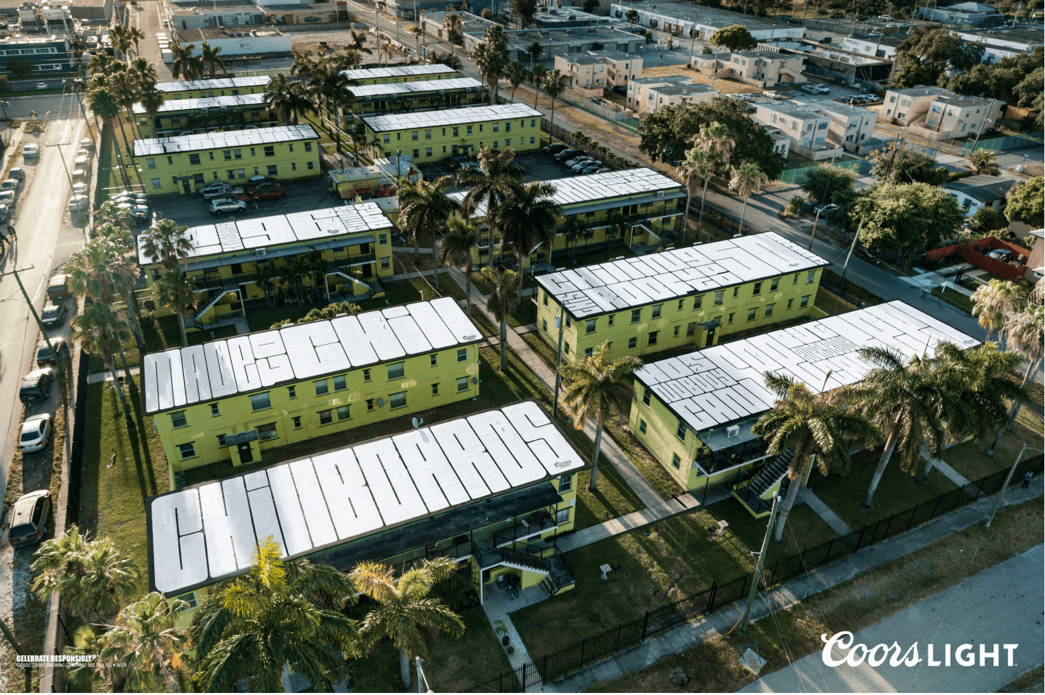 Coors Light 'Made to Chill' rooftop billboard campaign spelling messages across painted apartment building roofs in an aerial view