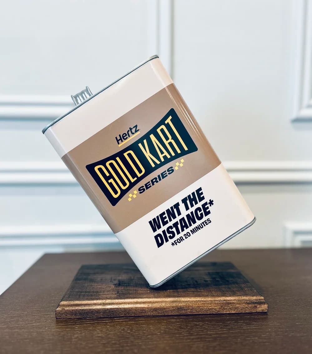 Custom Hertz Gold Kart Series trophy prop on wooden base